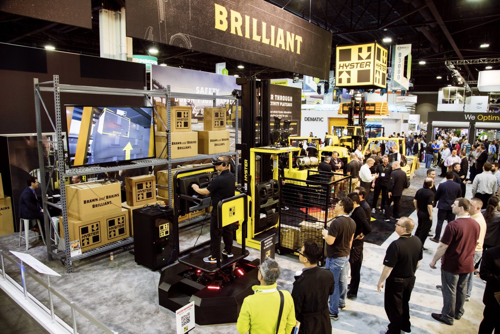 Crowd of people surrounding a trade show exhibit for Hyster.