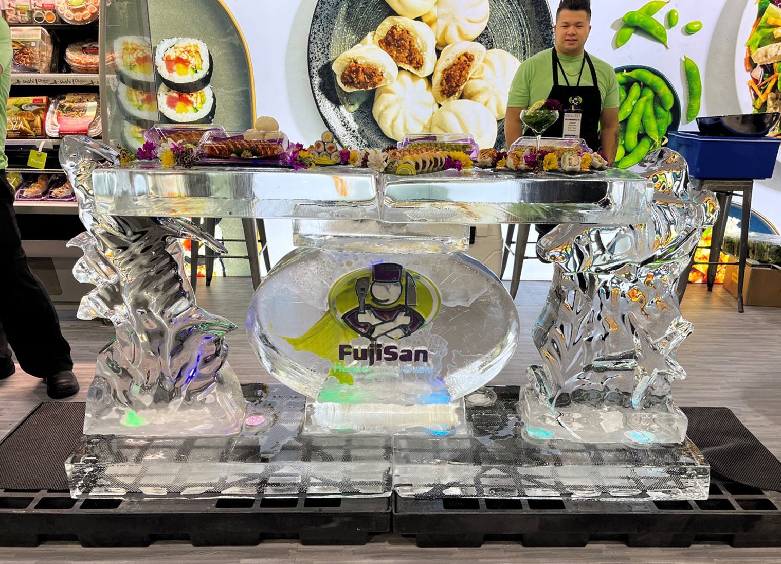 Fujisan's ice sculpture where they served sushi at IDDBA 2022.