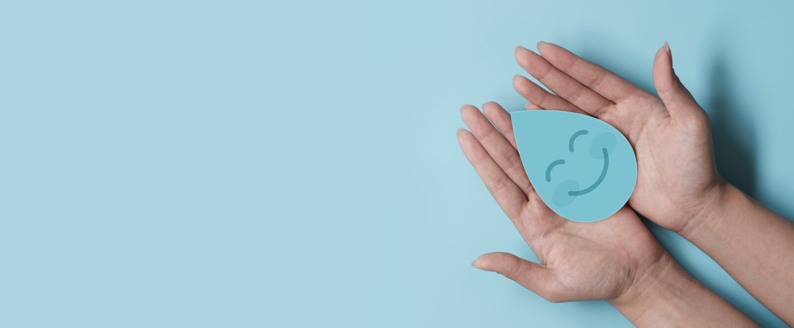 Woman hand holding smile water drop paper cut, world water day, clean water and sanitation, hand sanitizer and hygiene, washing hands, CSR, save water, clean renewable energy concept
