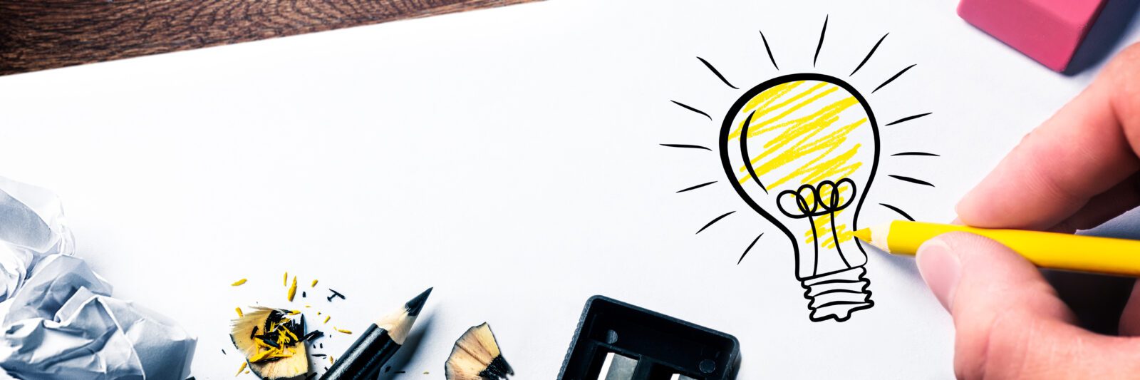 Hand Drawing Light Bulb On Paper - Bright Idea Concept