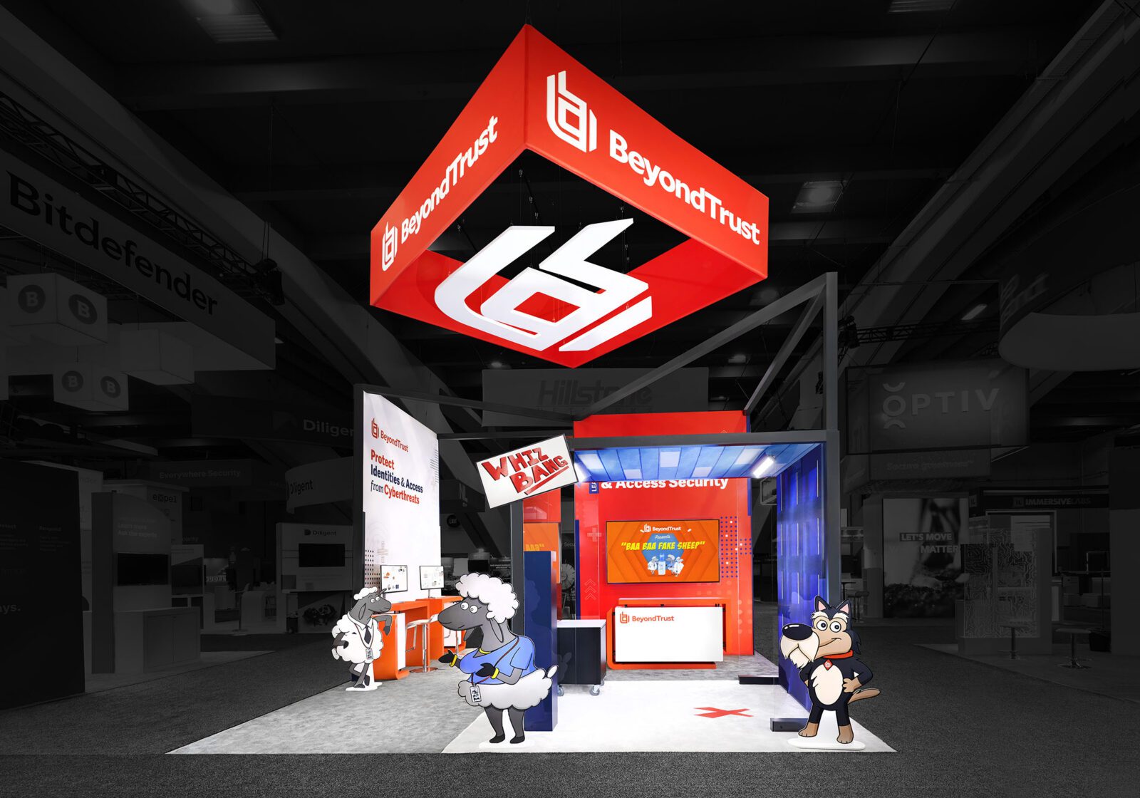 A trade show booth for BeyondTrust features a red and white overhead sign, digital displays, and cartoon animal mascots standing at the front.