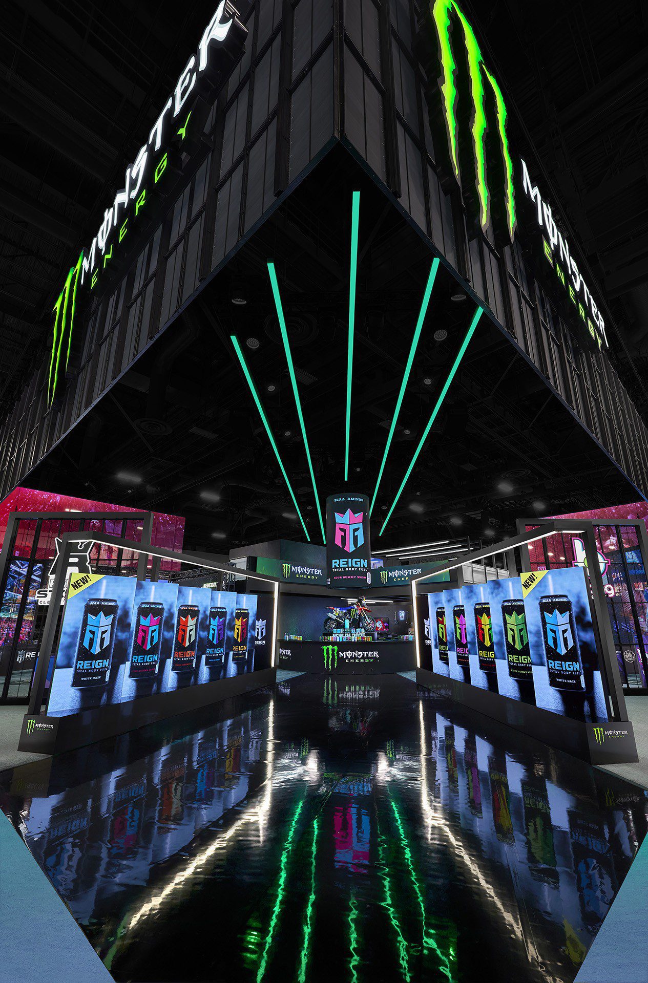Esports event stage with LED screens displaying team logos, Monster Energy branding overhead, and green accent lighting reflecting on a glossy black floor—an impressive example of trade show design that captivates both players and spectators.